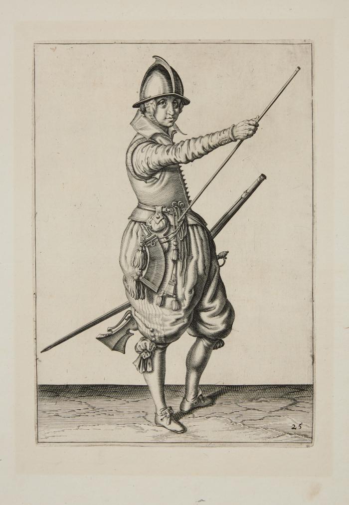 Soldat, seine Hand an das untere Ende des Ladestocks führend.